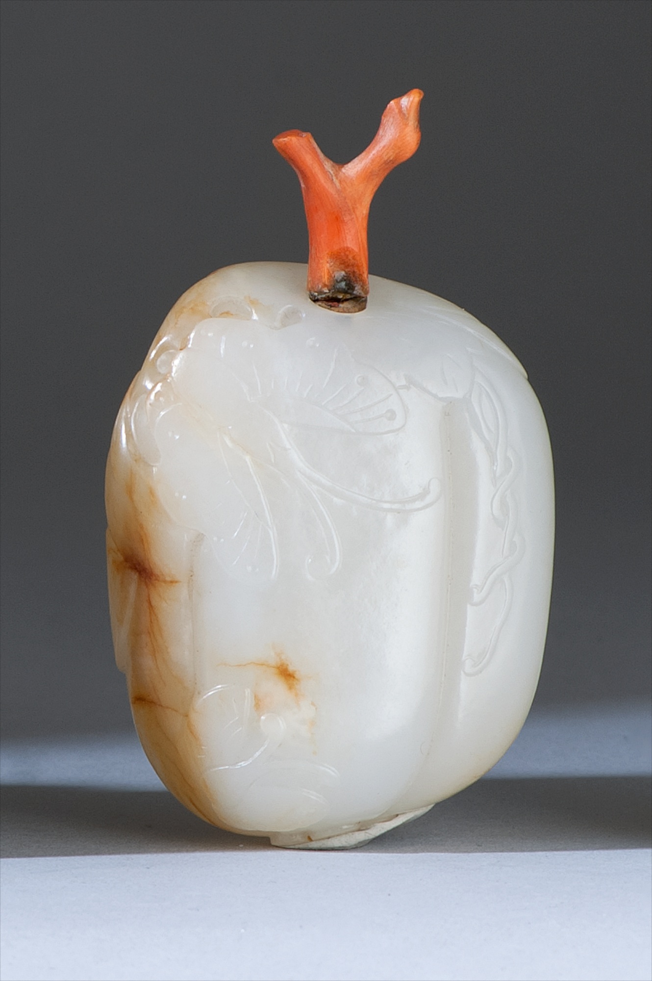 Appraisal: WHITE JADE SNUFF BOTTLE th CenturyIn fruit form with butterfly