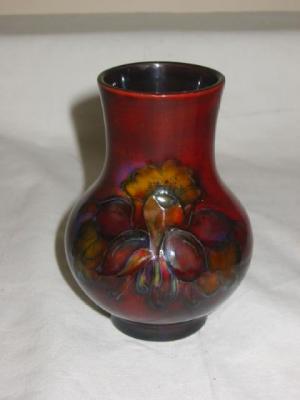 Appraisal: A MOORCROFT FLAMBE POTTERY VASE of bellied form tube lined