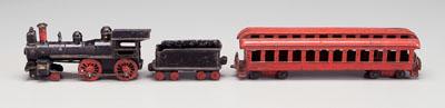 Appraisal: Cast iron locomotive passenger car and tender black-painted locomotive with