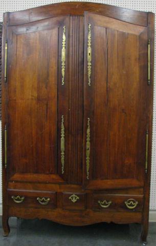 Appraisal: th Century European fruitwood armoire with handmade and engraved brass