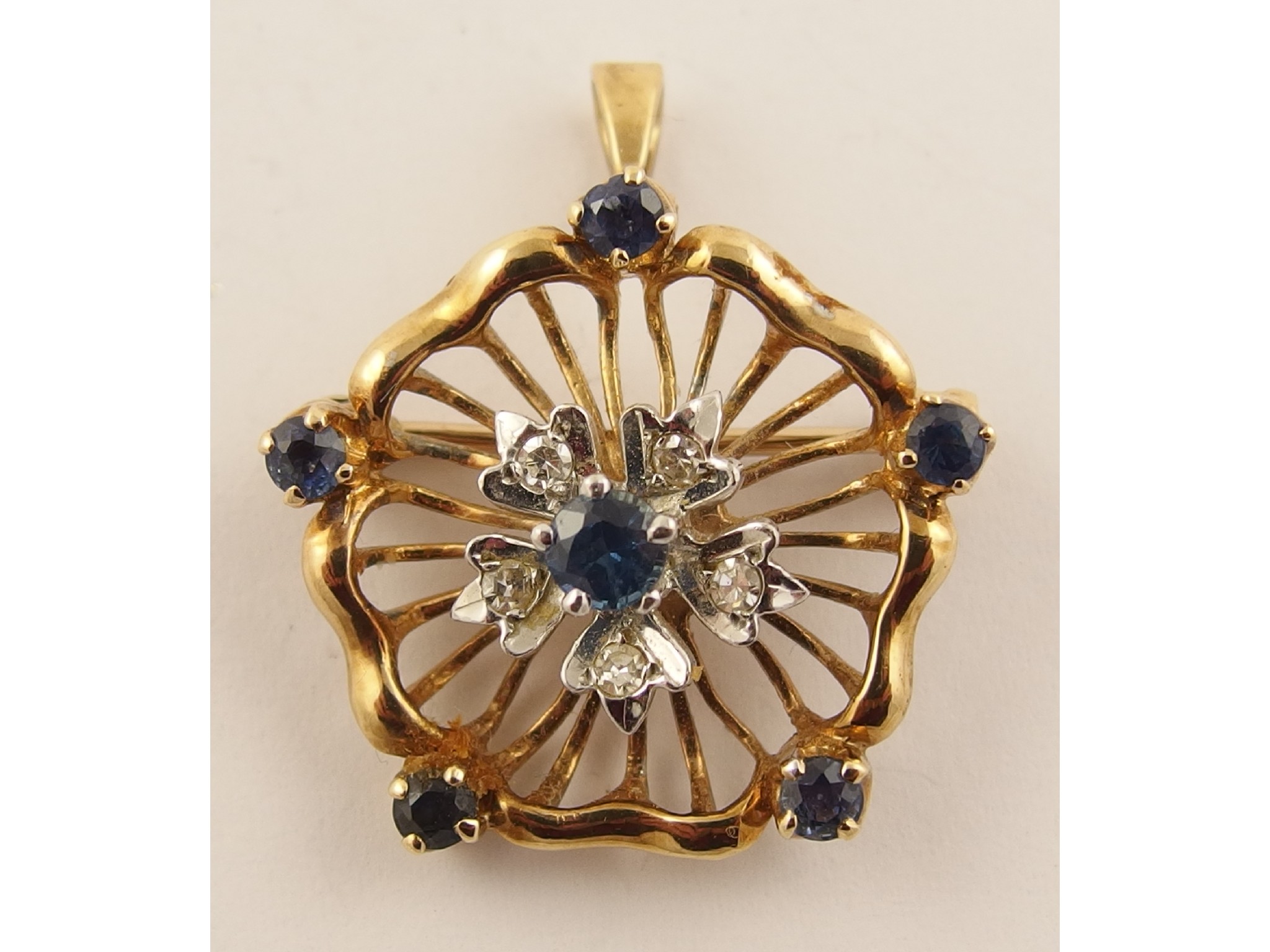 Appraisal: A ct flower pendant brooch set with diamonds and sapphires