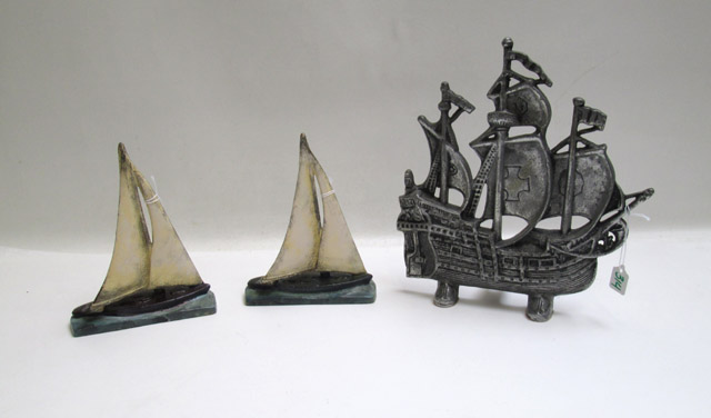 Appraisal: TWO HUBLEY ATTRIBUTED SAIL BOAT DOOR STOPS and one contemporary