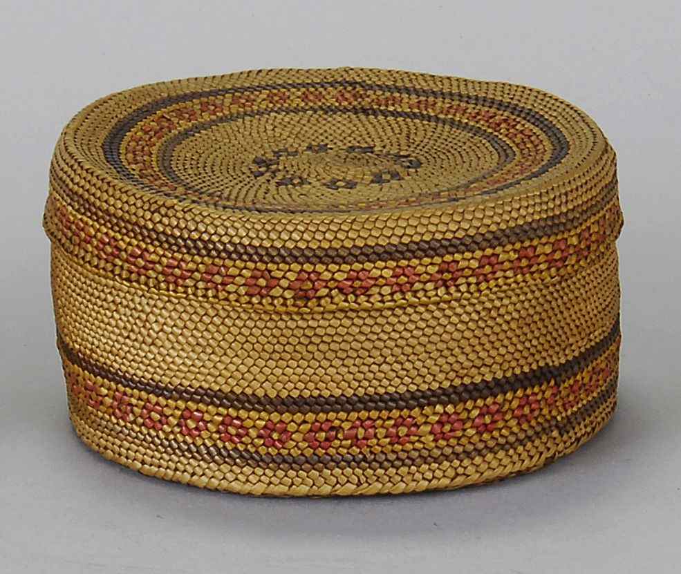 Appraisal: NORTHWEST COASTAL INDIAN COVERED BASKETCirca In a red blue and