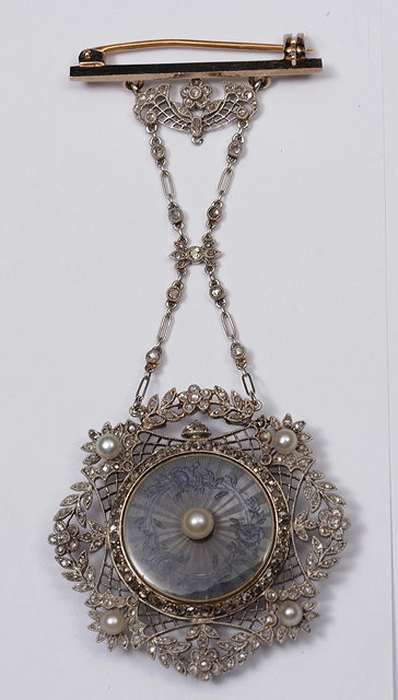 Appraisal: AN EDWARDIAN FOB WATCH of stylised form with filigree enamel