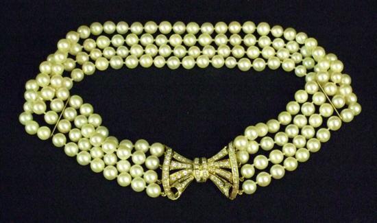 Appraisal: A FOUR STRING CULTURED PEARL CHOKER with diamond set gold