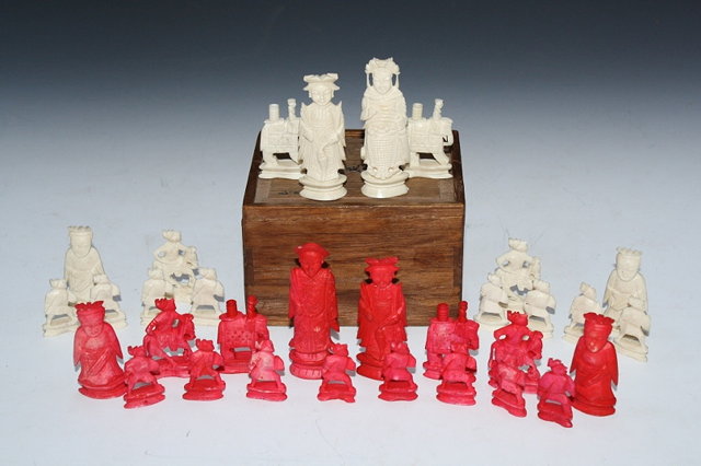 Appraisal: A CARVED AND STAINED BONE CHESS SET in the form