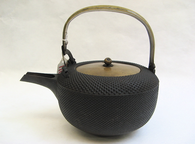 Appraisal: A JAPANESE CAST IRON CHOSHI SAKE KETTLE in the hail