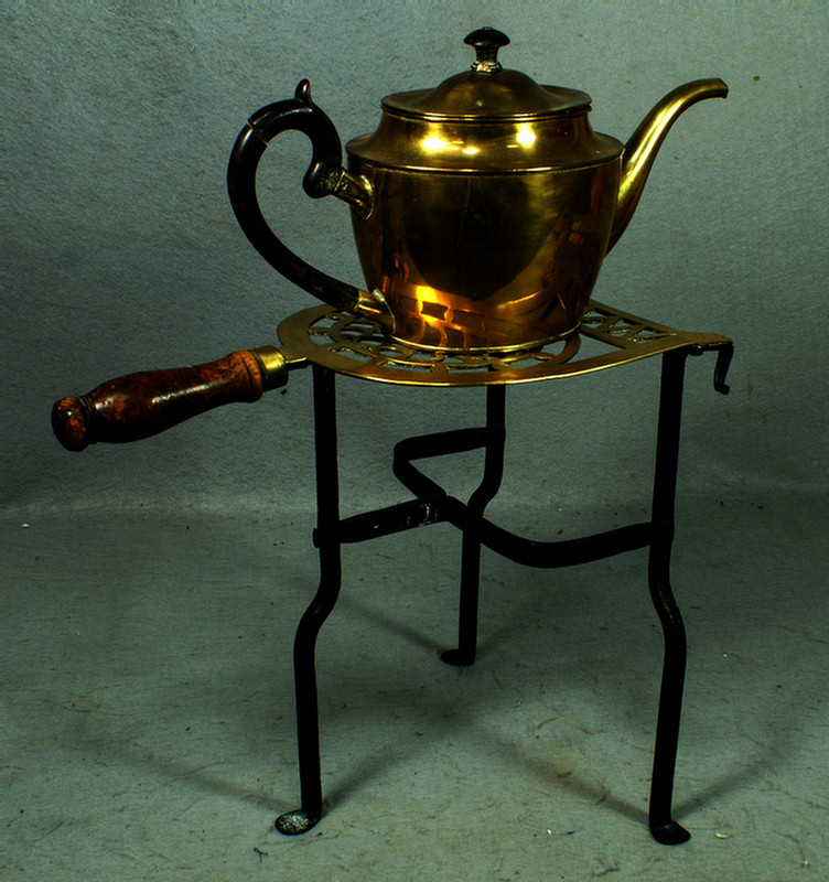 Appraisal: Brass and wrought iron trivet handle on brass teapot has