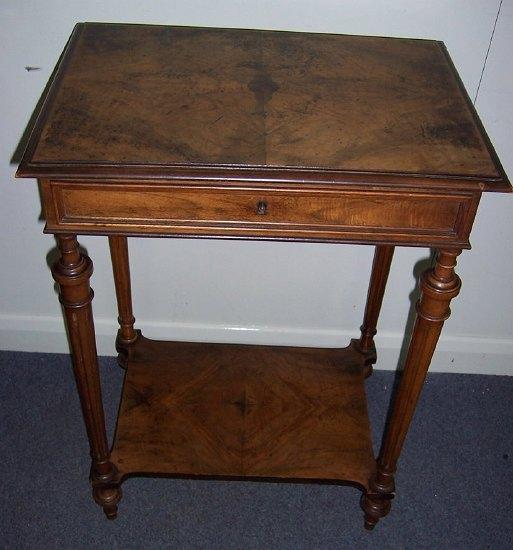 Appraisal: A th Century walnut side table the hinged lid enclosing