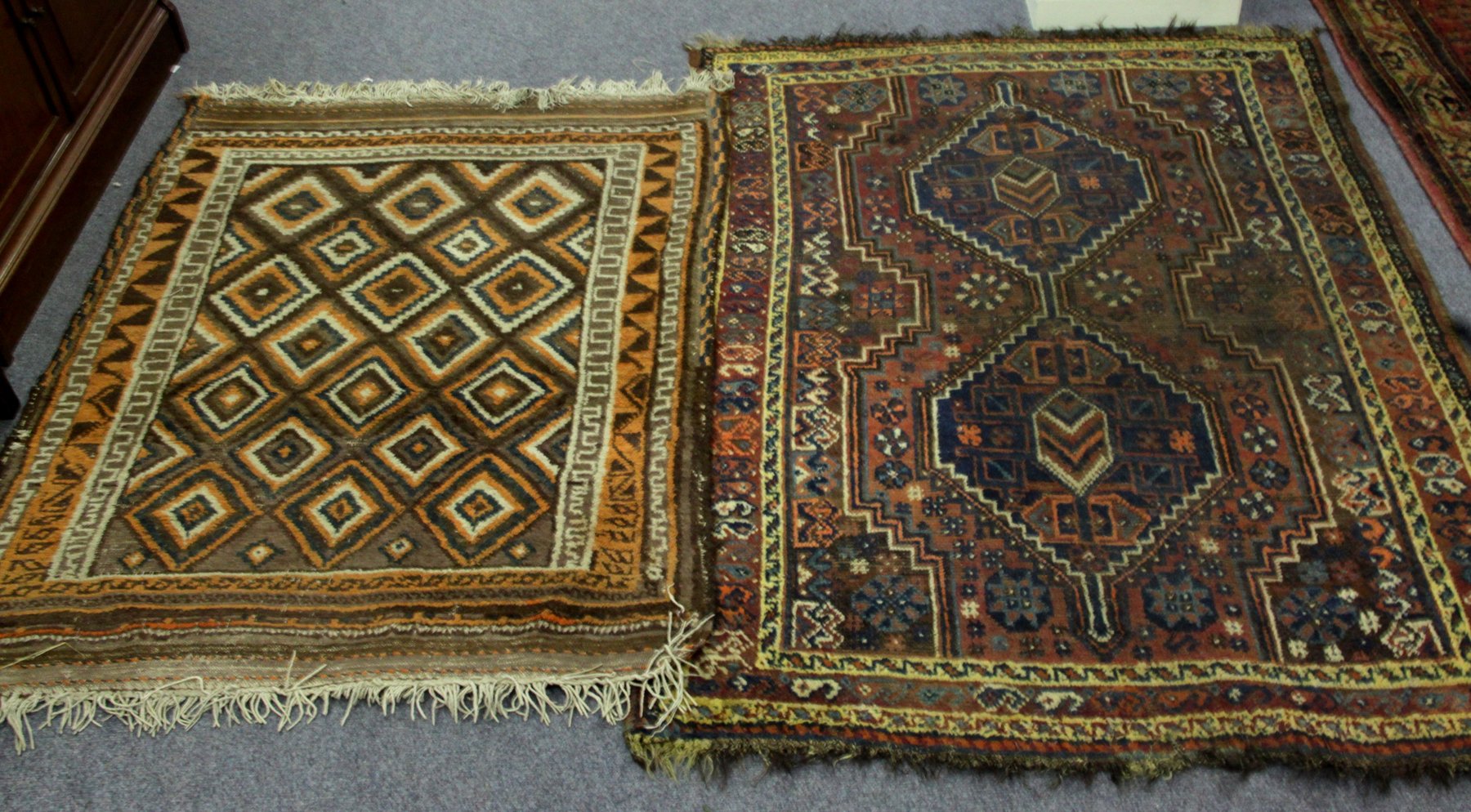 Appraisal: Two rugs one with indigo medallions the other with diamond