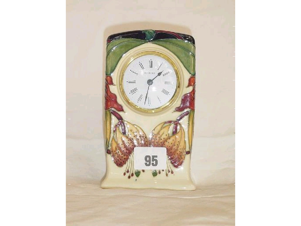 Appraisal: A cream ground Moorcroft clock case with painted and moulded