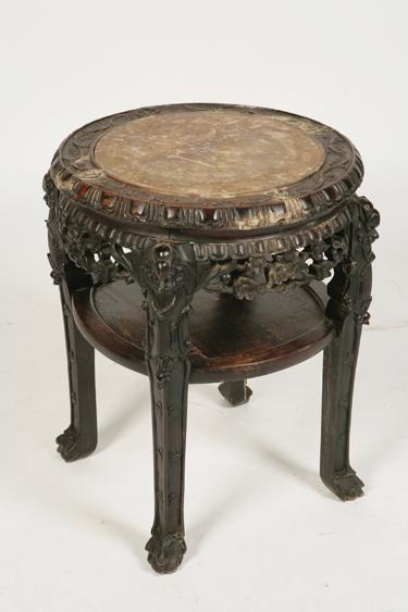 Appraisal: A CHINESE HARDWOOD URN STAND the circular top set with