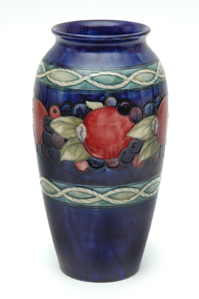 Appraisal: A MOORCROFT POMEGRANATE PATTERN VASE Post Baluster with a continuous