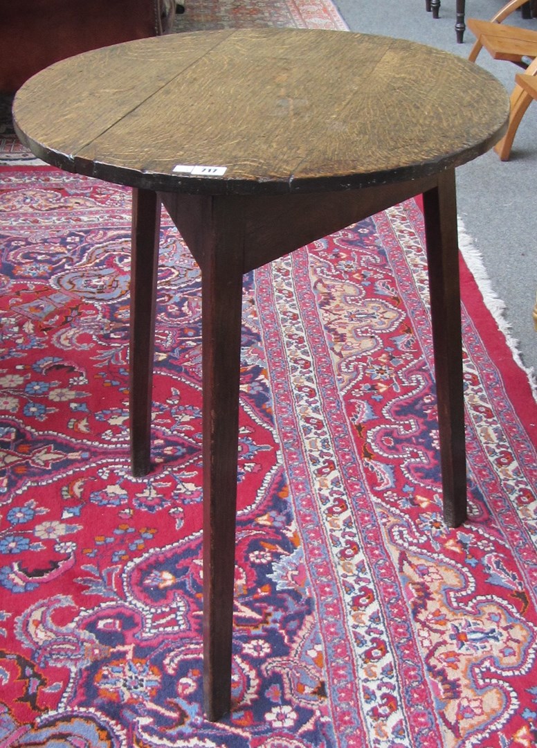 Appraisal: An th century oak cricket table the circular top on