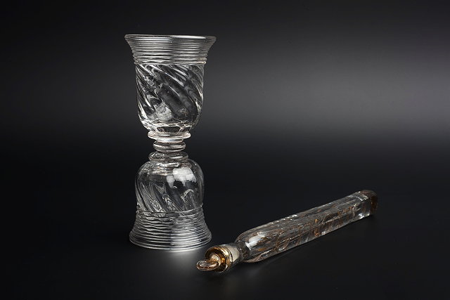 Appraisal: AN TH CENTURY GLASS DOUBLE ENDED DRAM GLASS with ridged