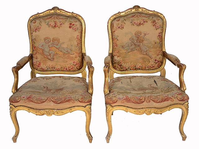 Appraisal: A PAIR OF LOUIS XV STYLE CARVED GILT WOOD FAUTEUILS