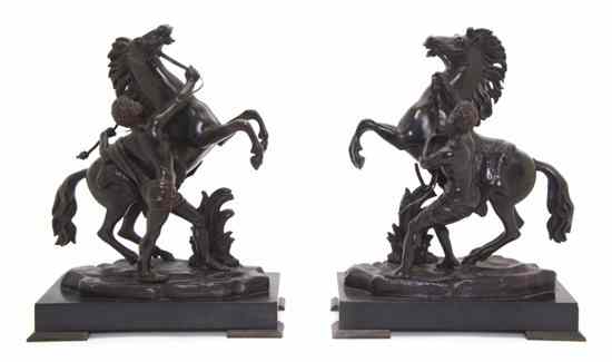 Appraisal: A Pair of Continental Bronze Figural Groups after Cousteau depicting