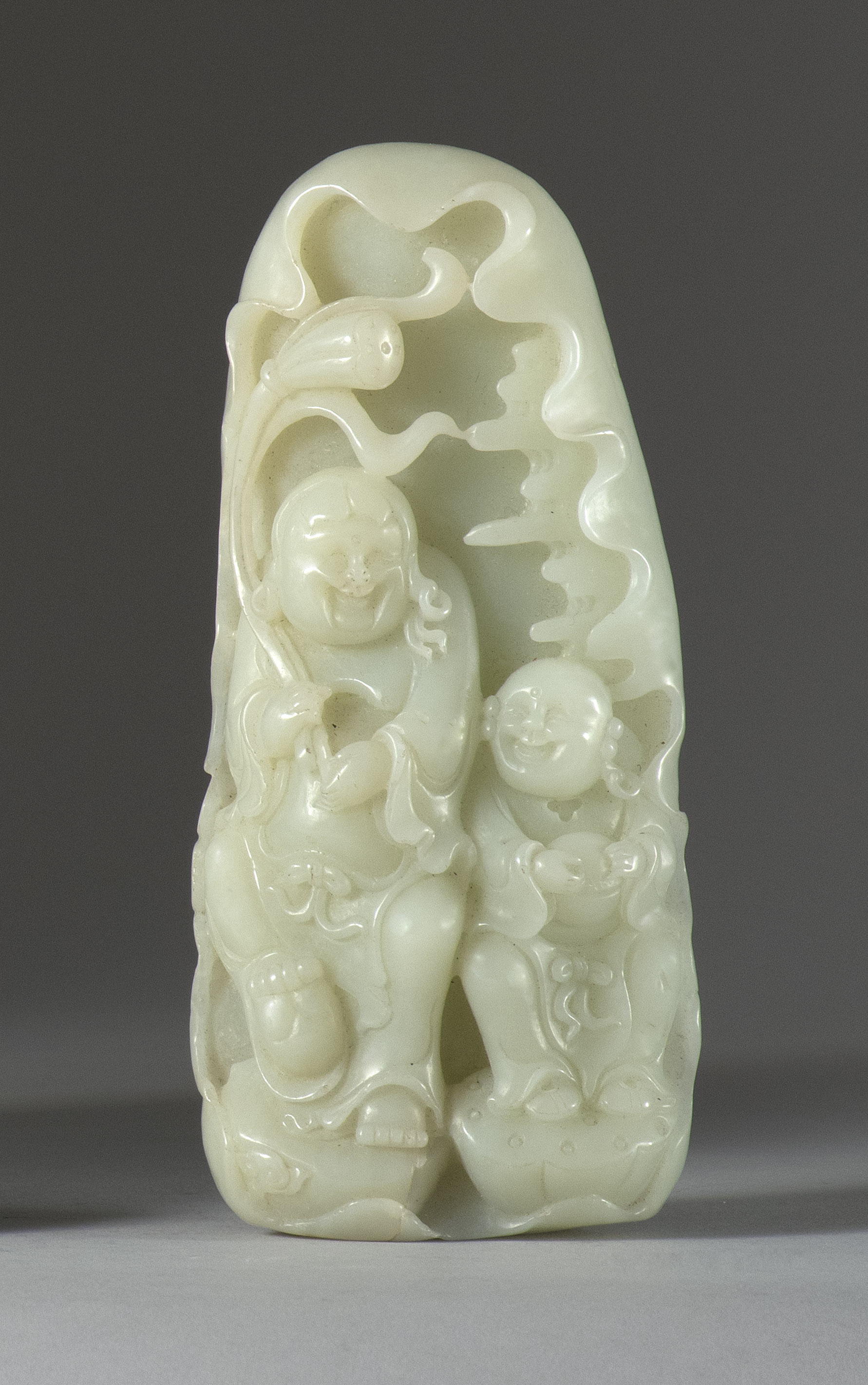 Appraisal: PALE CELADON JADE CARVING Depicting two Immortals emerging from waves