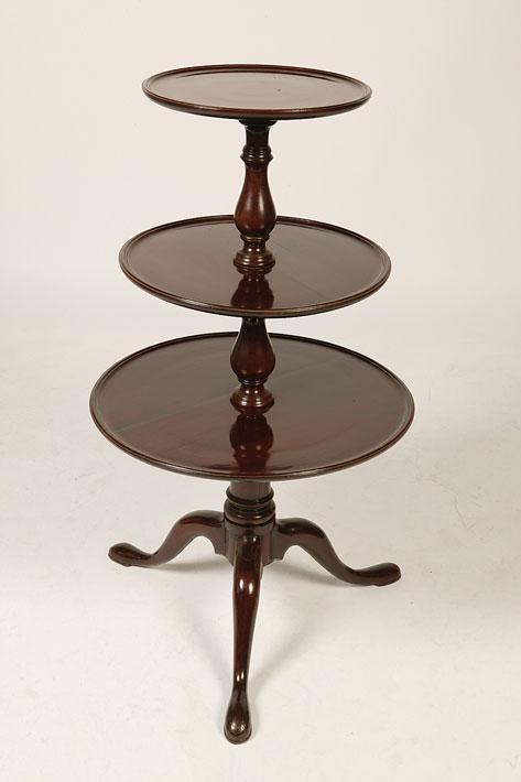 Appraisal: A GEORGE III MAHOGANY THREE TIER DUMB WAITER with three