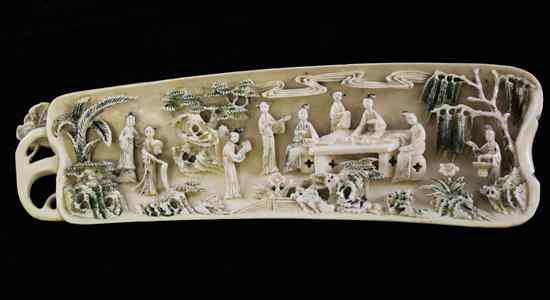 Appraisal: A Chinese ivory wrist rest early th century carved in