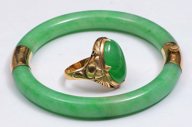 Appraisal: A JADE BANGLE and a signet ring each with ct