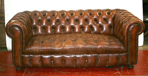 Appraisal: A leather upholstered Chesterfield sofa th century width ft in