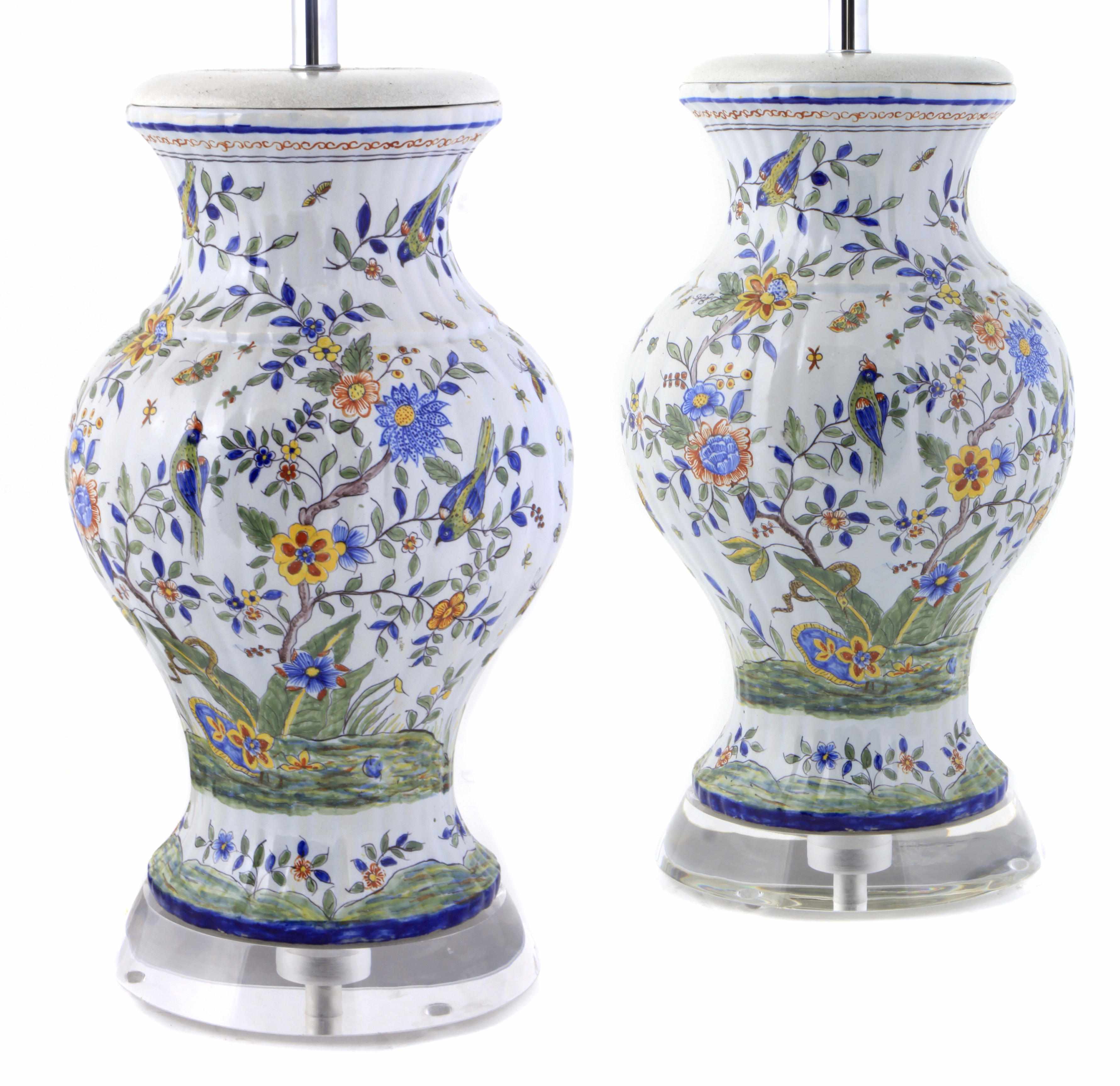 Appraisal: A pair of tin glazed polychrome decorated vases now mounted