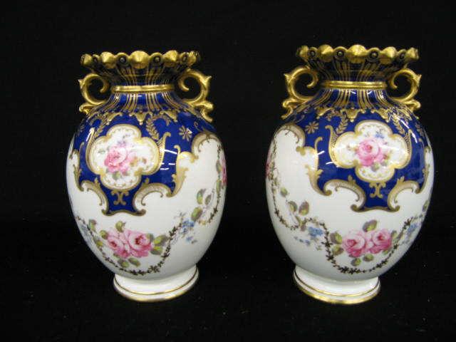 Appraisal: Pair of Royal Crown Derby Porcelain Vases handpainted floral garland