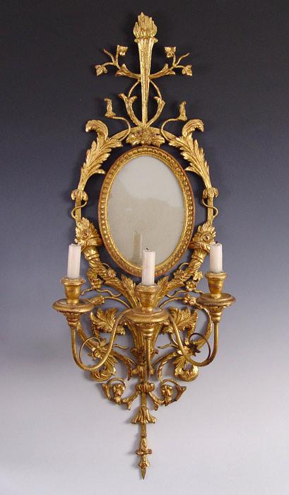 Appraisal: CHELSEA HOUSE GILT CARVED WOOD LIGHT MIRROR SCONCE Oval mirror