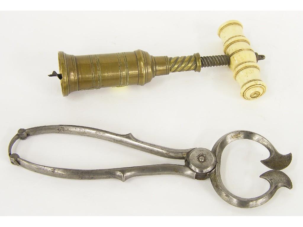 Appraisal: th century brass corkscrew with turned ivory handle also an