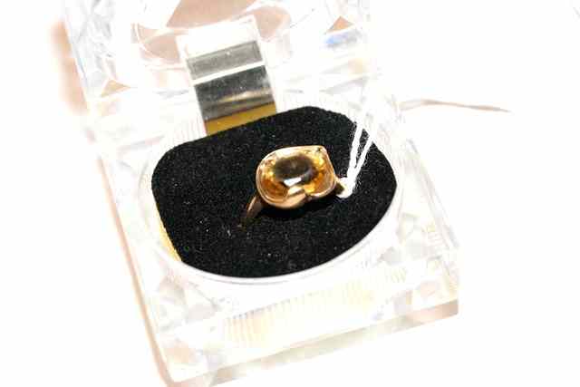 Appraisal: A CITRINE DRESS RING oval facet cut citrine set with