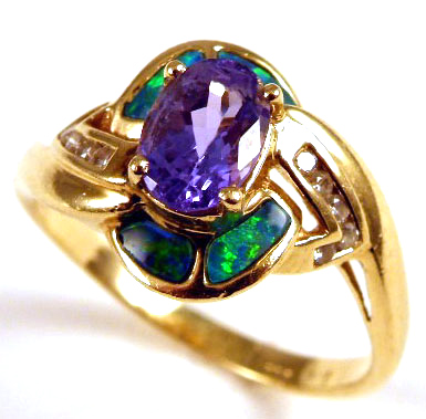 Appraisal: TANZANITE OPAL AND DIAMOND RING k yellow gold centering an