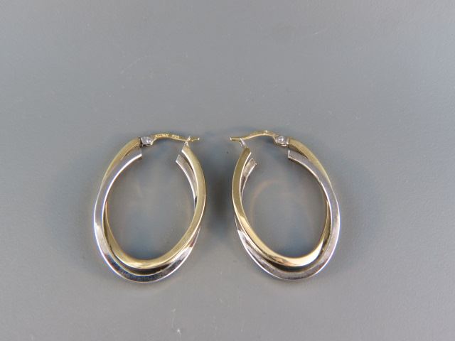 Appraisal: Earrings large oval hoopswith criss crossing sterling k yellow gold