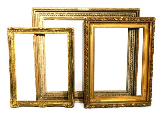 Appraisal: Three large wooden picture frames foliate motifs minor losses and