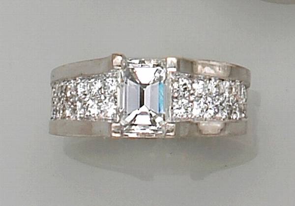 Appraisal: of bridge design centering an emerald-cut diamond set over a