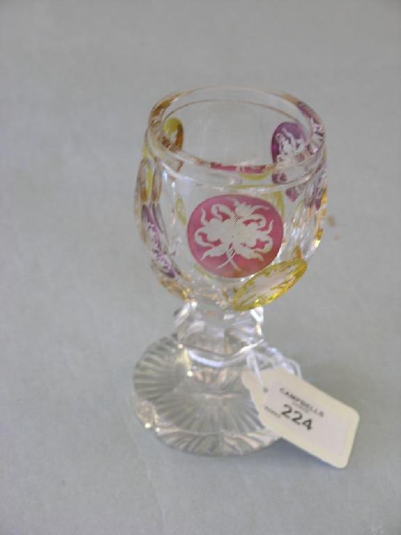 Appraisal: A th Century Bohemian glass goblet with overlaid engraved roundels