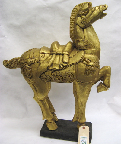 Appraisal: TWO CHINESE GILDED CARVED WOOD FIGURES Tang style horse on