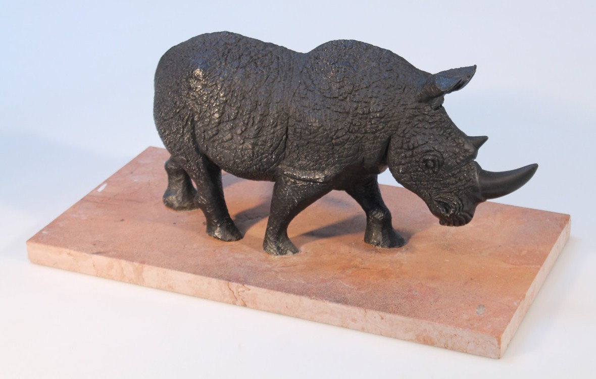 Appraisal: A resin figure of a standing black rhino on a