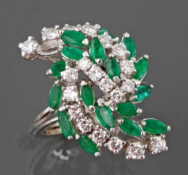 Appraisal: An emerald diamond and k white gold ring one emerald