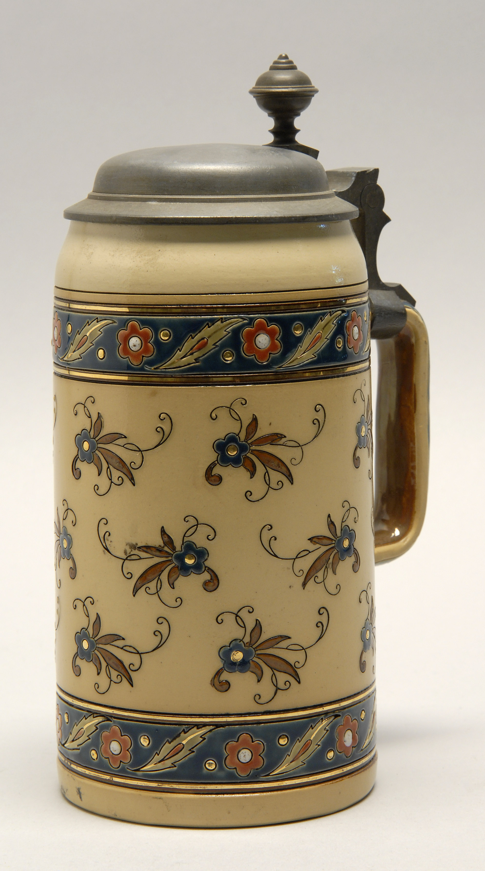 Appraisal: METTLACH STONEWARE ONE-LITER STEIN Pewer cover and thumbpiece Cylindrical body