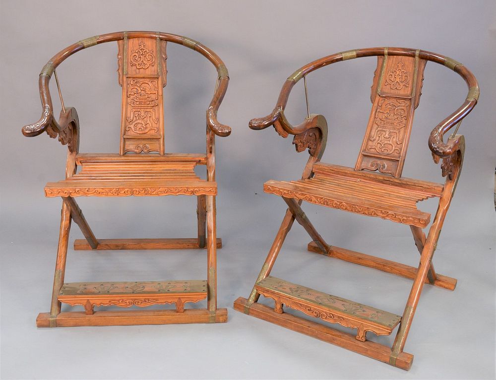 Appraisal: Pair of horseshoe folding campaign armchairs China th th C