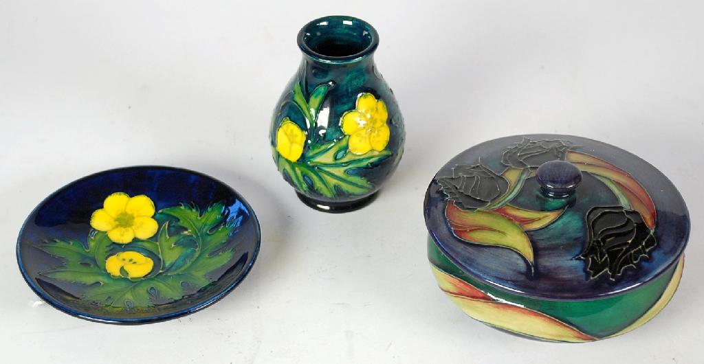 Appraisal: THREE PIECES OF MODERN MOORCROFT POTTERY comprising black tulip pattern