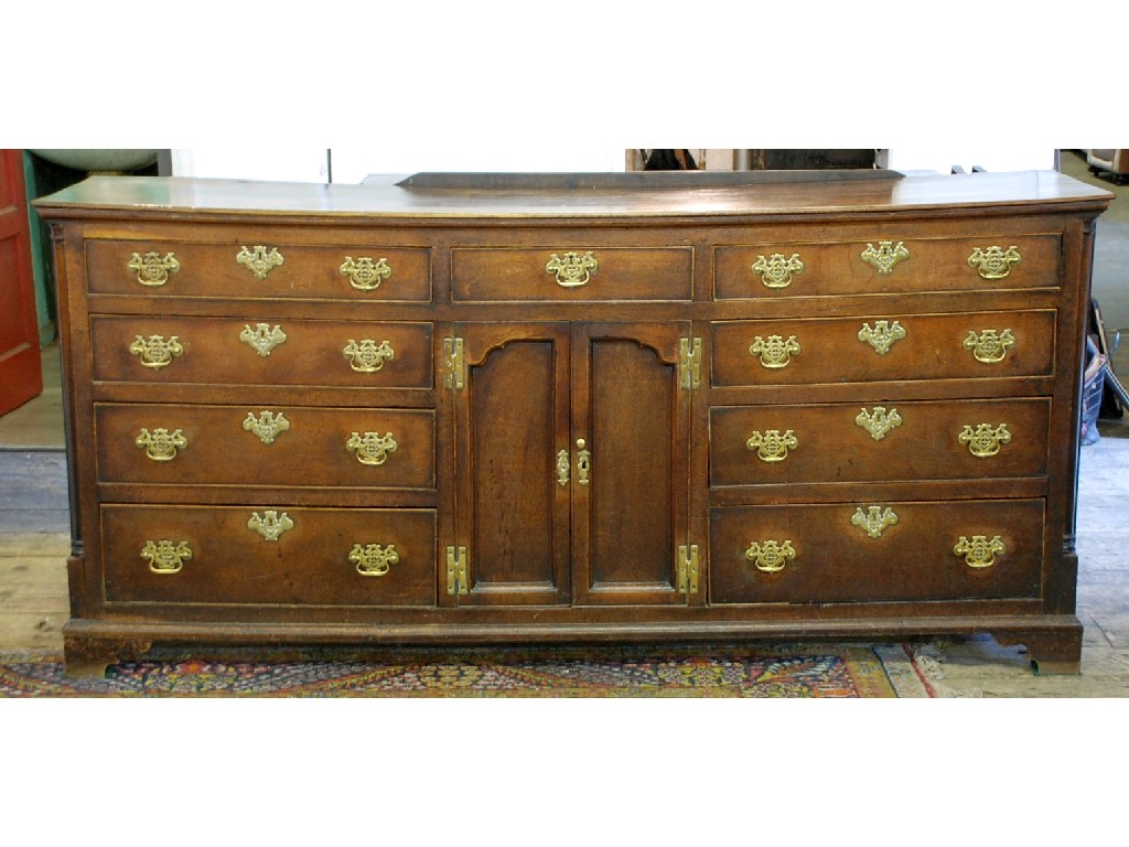 Appraisal: GEORGE III OAK DRESSER the moulded rectangular top above a