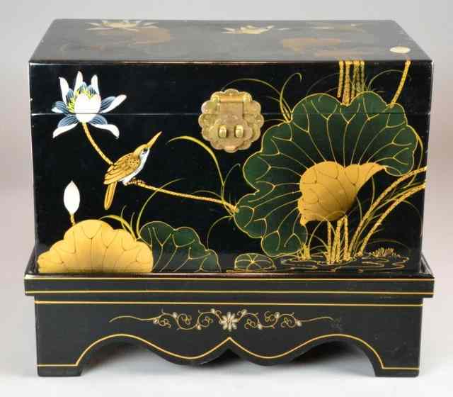 Appraisal: A Chinese Black Lacquer TrunkBlack lacquer trunk decorated with lotus