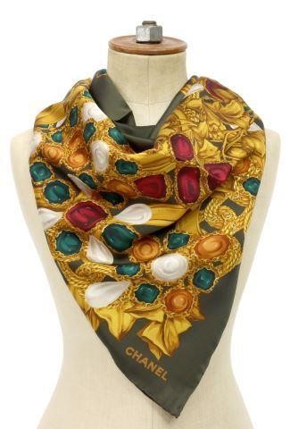 Appraisal: Chanel silk scarf army green ground showing rubies emeralds and