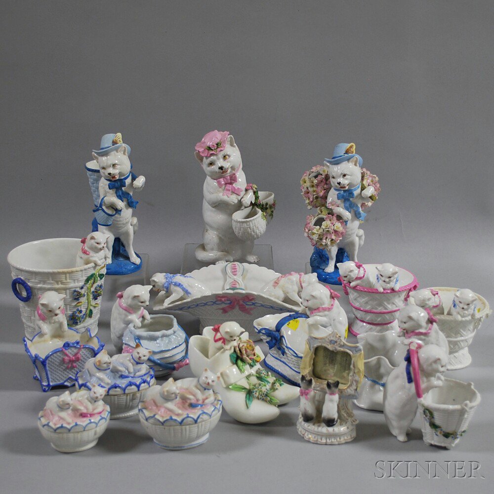 Appraisal: Seventeen Porcelain Cat-related Items including a cat figure on blue