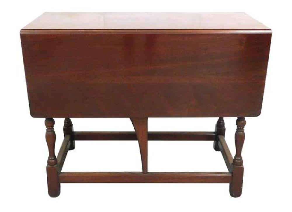 Appraisal: Dropleaf table turned legs on square feet small drawer at