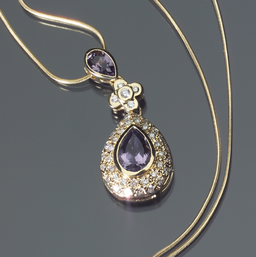 Appraisal: Diamond and amethyst pendant in k yellow gold Three tiered