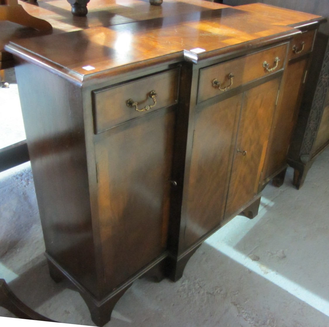 Appraisal: A th century mahogany breakfront side cabinet