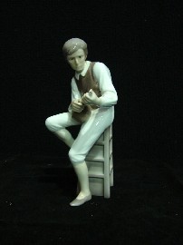 Appraisal: A Bing Grondahl figure of a seated mandolin player cm